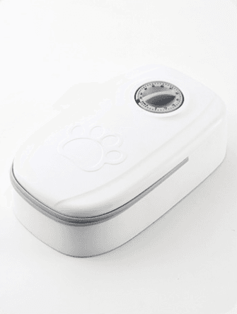 Comedero con temporizador mecánico para una comida